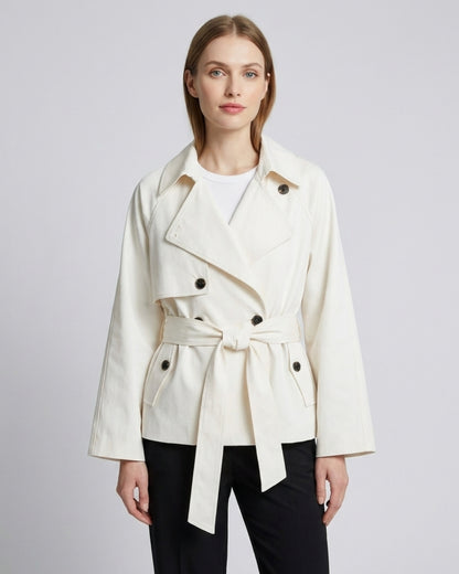 Harper short asymmetric double-breasted trench coat in beige, model photo